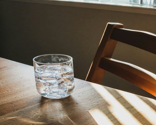 A clear glass of water on a table